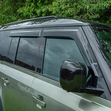 Upgrade your Land Rover Defender 90 110 130 with this 4-piece Wind Deflector set. No drilling required, these front and rear deflectors provide maximum protection against wind and debris while enhancing the vehicle's sleek design. Perfect for any adventure, you can confidently tackle any terrain in style.